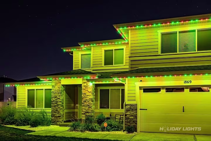 Permanent roofline lights installed along the full eaves of a Connecticut home